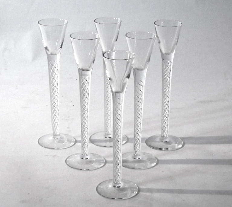 Six hand blown  long spiral thread stemmed Aquavit glasses from Denmark. Beautiful design and execution.