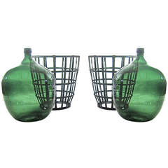 Two French Blown Glass Demijohn and Metal Baskets