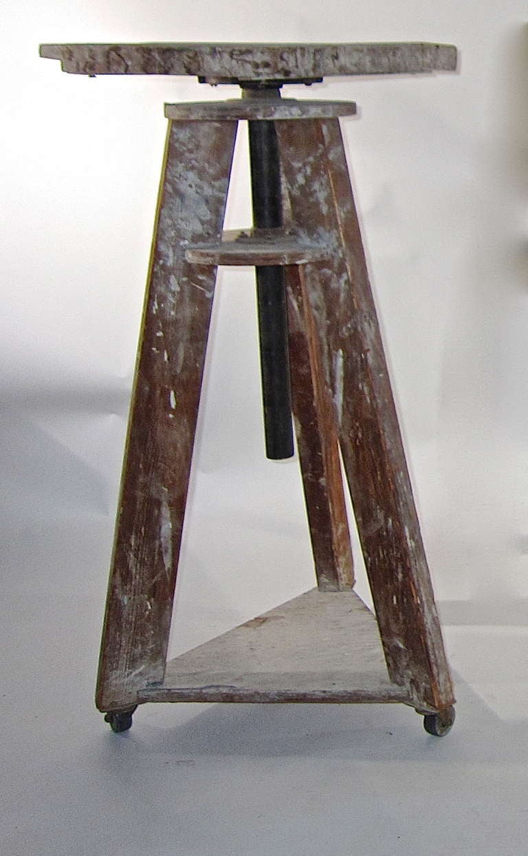 A  sculpture stand from a studio in northern New Jersey. The surface is as found and in original working condition.
The stands have a revolving work table and adjustable height. They were from an artist studio on an estate.
The stands are offered