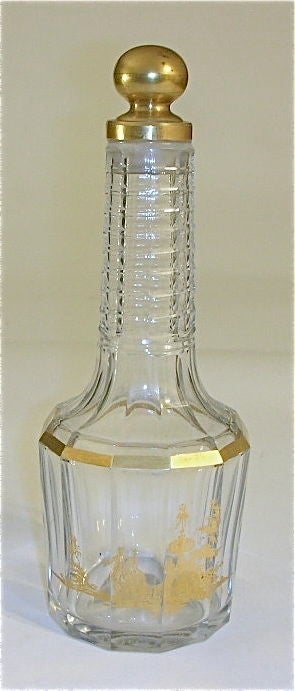 Baccarat number 103 perfume bottle. An especially hard to find flacon with gold decoration and stopper. We have not seen another 103 bottle, Classic shape with gold figures decorating the main body. The stopper and bottle etched with model number