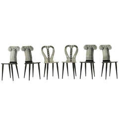 Set of six dining chairs by Fornasetti.