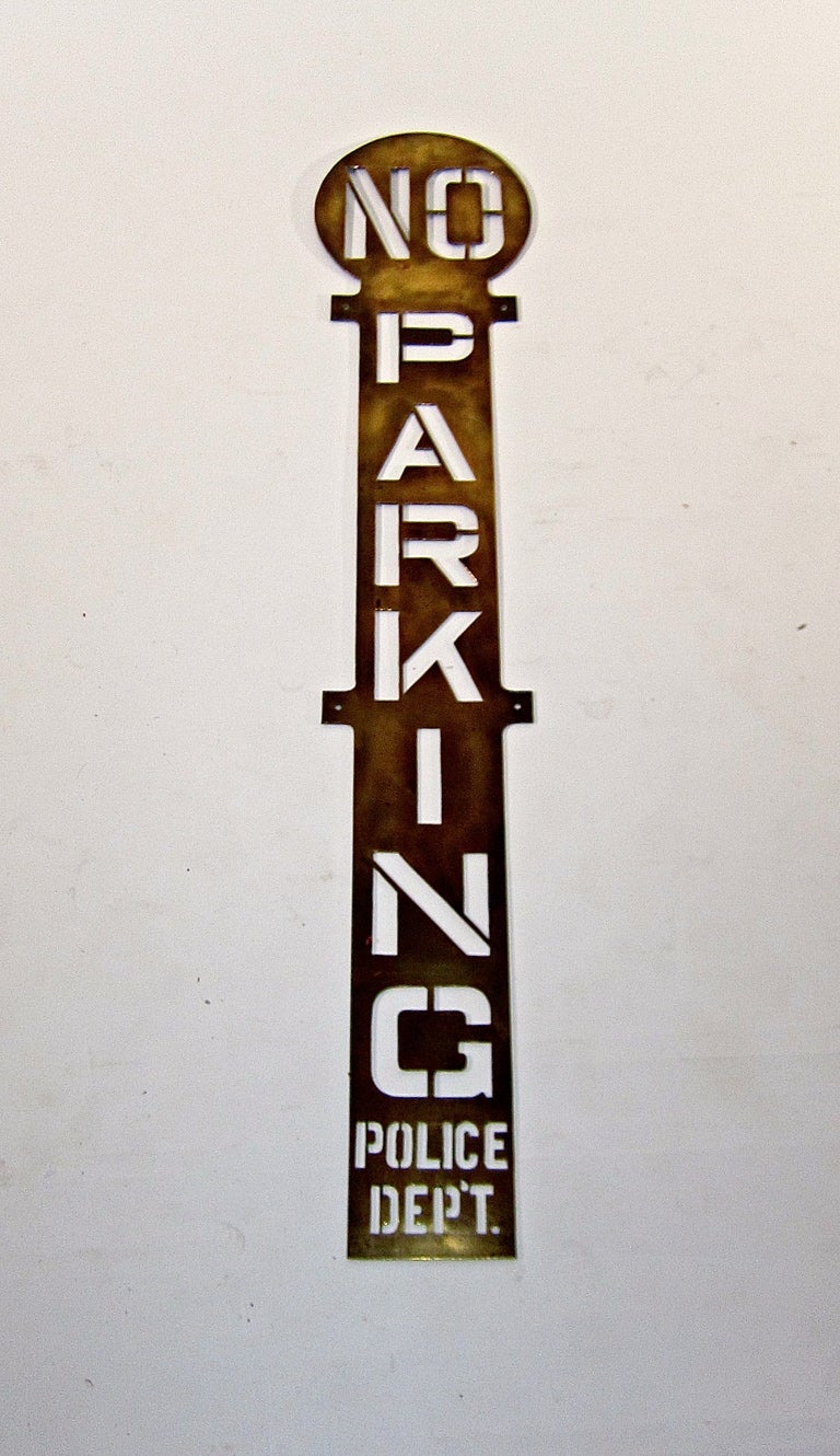 Solid brass sign, possibly a sign stencil. 