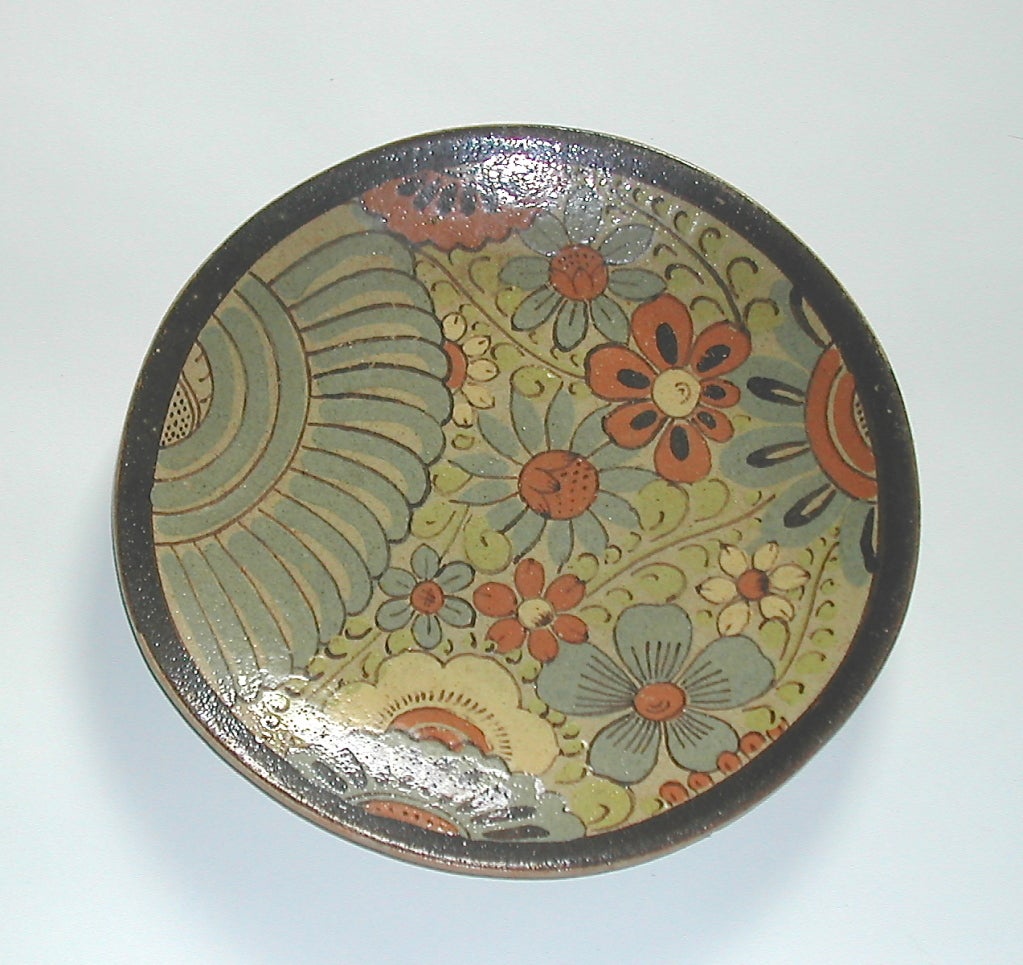 A most attractive hand decorated glazed earthenware plate from a talented Mexican artisan.