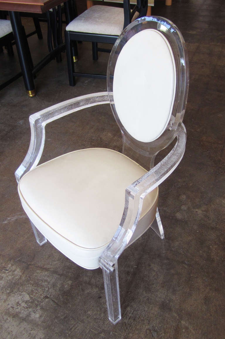 Four Louis XVI-style armchairs in lucite and the original cream leather upholstery by American lucite master Charles Hollis Jones.
