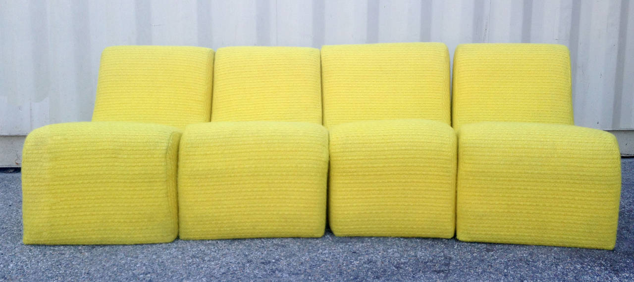 This set of sectional sofa pieces were designed by Milo Baughman for Thayer Coggin. The armless pieces can be arranged together or separately for a unique, enlivening look. Each piece of the set retains its original yellow upholstery that is in good