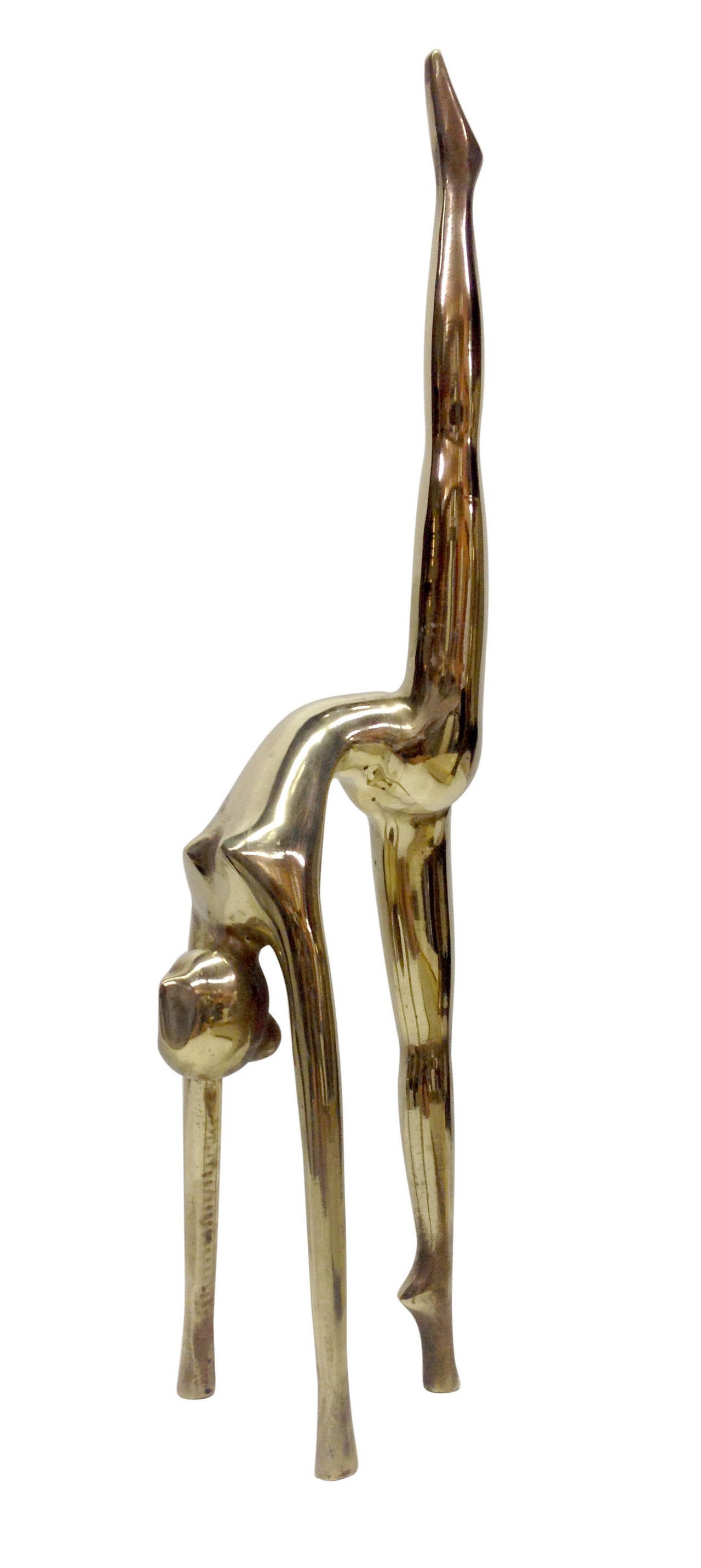 This sculpture depicting a gymnast is rendered entirely out of bronze in a smooth, elongated fashion. She can stand alone as a sculpture, or could be used as a jewelry holder or a paperweight.