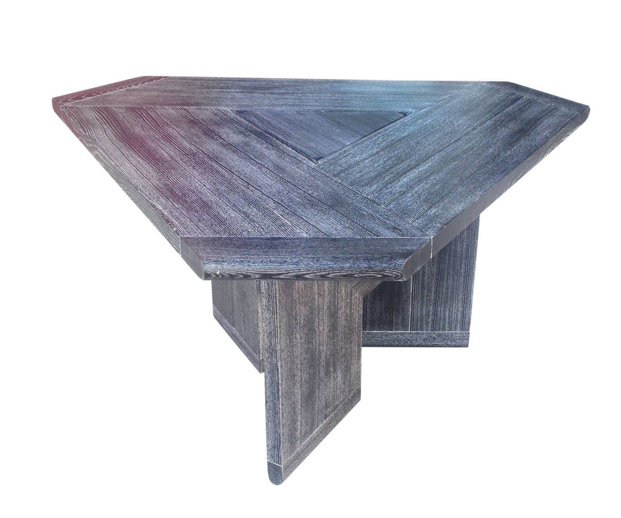 This functional and elegant dining table features a unique triangular surface supported by three very architectural L-shaped legs. A hidden compartment in the center of the table is revealed by lifting off a triangular lid which has been made
