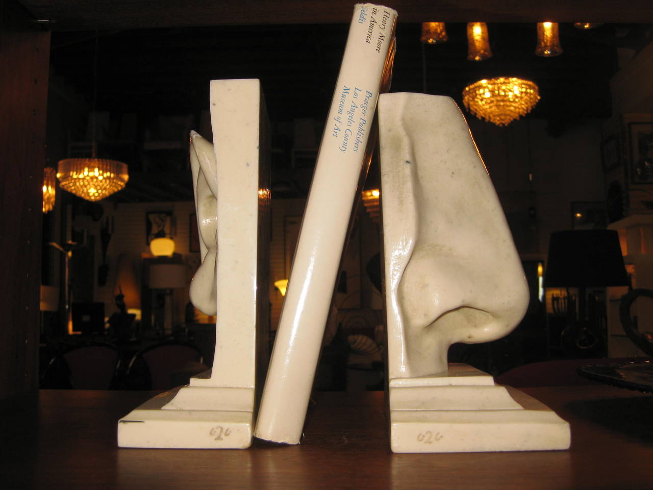 A pair of figural bookends from Italy rendered in resin.
The indicated measurements are for the nose. The ear measures 3.13