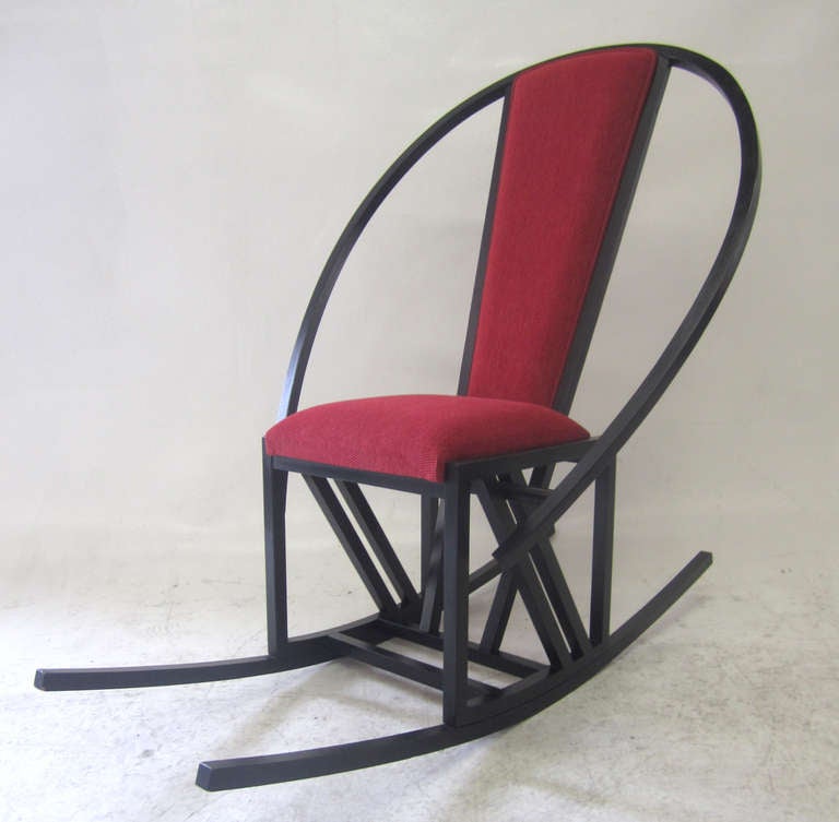 This dynamic, rocking chair features the dramatic lines of the Memphis Design Movement specifically echoing the style of Michele de Lucchi's iconic chair.
