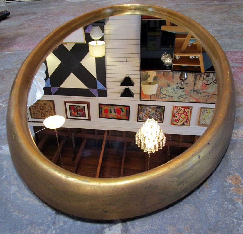 Oval Wall Mirror  with a gilt wooden frame.