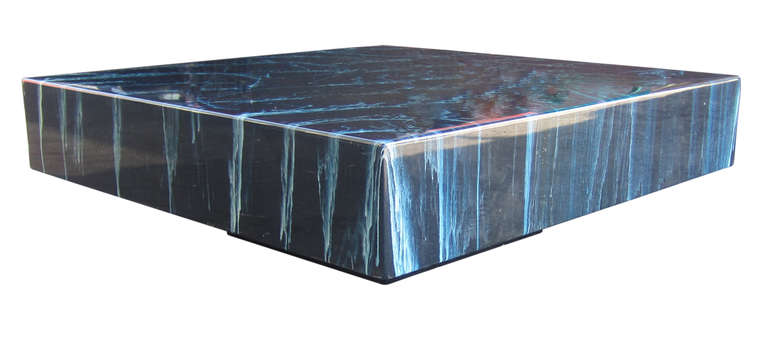 This spectacular 1970s, square coffee table by Arthur Elrod (1926-1974) features an expertly controlled, faux marble finish within the resin. The table appears to float as it rests on a recessed base in black. Elrod was a celebrated California