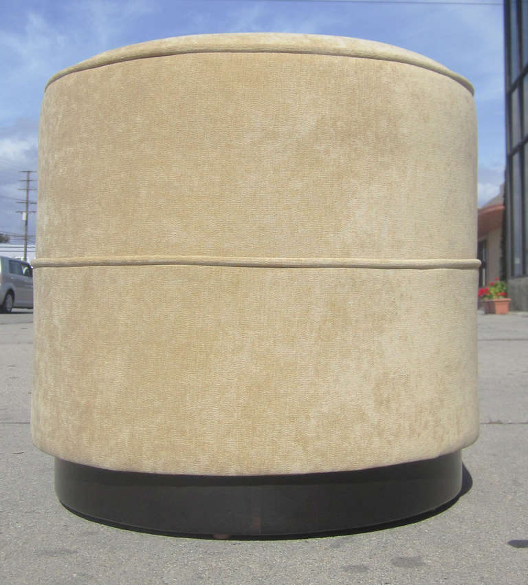 This French Art Deco ottoman / stool made by Jean Pascaud in the 1930s features an cylindrical frame supported by a base in ebonized wood. The stool has been newly re-upholstered in yellow chenille upholstery. 

* Please see our listing for the