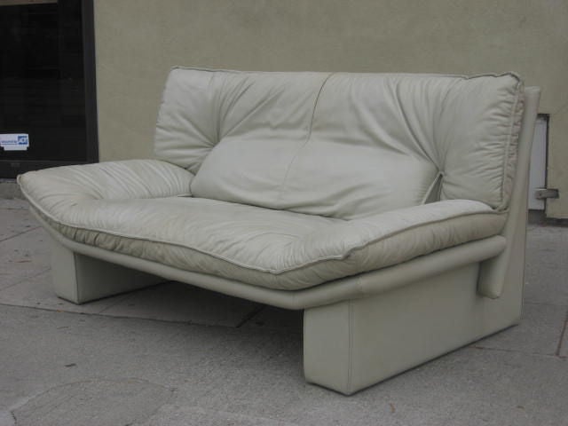 Loveseat covered in a very light gray leather (almost white)
The quality of the leather and the comfort are awesome.