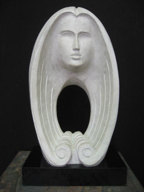 Minimal and figurative sculpture. Piece is made of hard plaster and rests on a black formica base. Image has a classic Deco or Art Nouveau motif and evokes various meanings when studied. The face of a woman is universal and the the hair flowing down