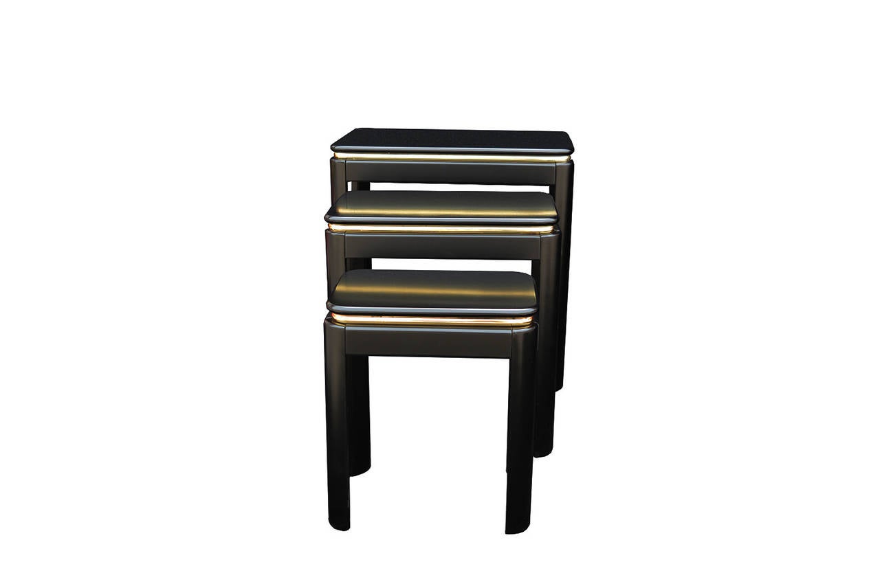 Black lacquer nesting tables with brass banding.
The measurements listed are for the bigger one. The medium one is 11,5