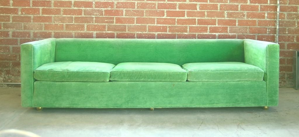 A Set of 2 three seat sofa designed by Milo Baughman from the 1970’s. This clean line sofa is upholstered in an original intense green fabric but would need to be redone. The back cushions are missing. <br />
They can be sold individually and the