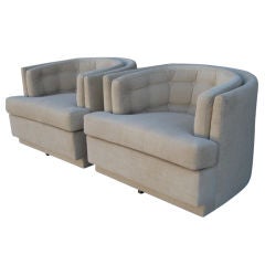 A Pair of Barrel Swivel Chairs