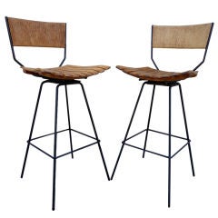 A Pair of Swivel Bar Stools by Arthur Umanoff