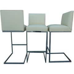 A Set of 3 Cantilevered  Bar Stools by Milo Baughman