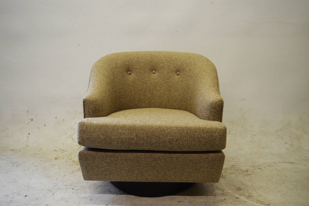 These chairs swivel on a walnut base.
They have been re-upholstered in a light beige canvas.
Very comfortable.
