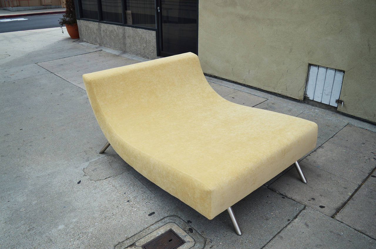 This chaise features a wavy very comfortable body with metal powder coated feet. It's covered in soft yellow microfiber chenille.
The back view is also beautiful.