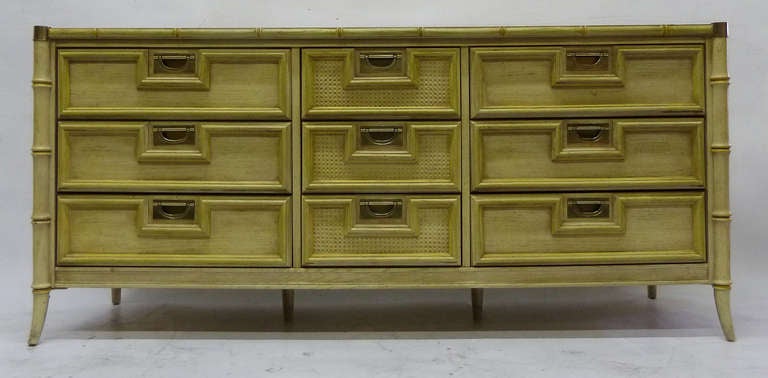 Nine drawer faux bamboo dresser made in mahogany with a cream patina finish.
Note the high quality of the brass hardware.