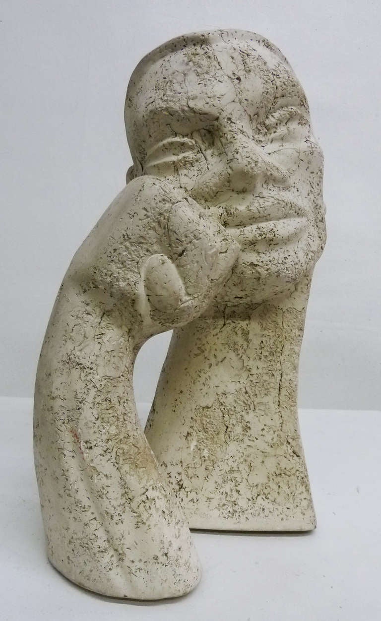 This engaging bust by celebrated mid-century, California artist, LeRoy Benjamin, depicts the head of man resting against his closed fist. Depending on which angle you look at it, the subject appears at turns contemplative, content or even