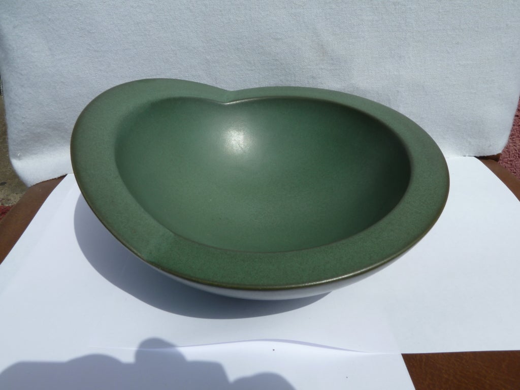 This sculptural, ceramic bowl features a rich, jade colored glaze. The piece retains the original Claude Dumas sticker on the bottom.
Dumas, a multimedia artist, was born in Roanne in 1955. He lives and works in Paris. In 2002 he became a professor
