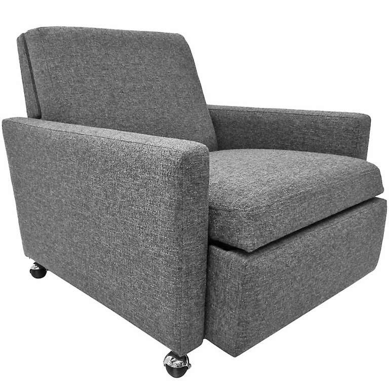 This reclining armchair by celebrated American designer Milo Baughman, is newly upholstered in grey boucle. 
When reclined, a clever headrest pops up along with the requisite footrest; here it measures 35.5