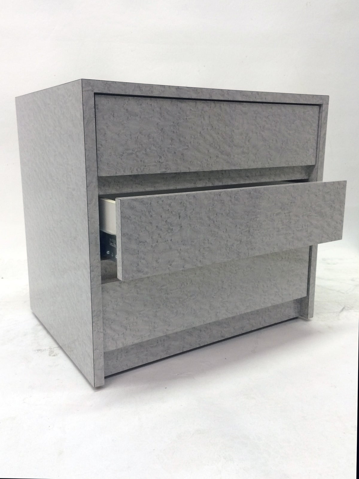 Two matching grey birds eye maple like laminate night stands by Contemporary Mica Inc of Chicago. Three drawers each - white inside.  Give your design project a chic, playful modern feel with these matching 80's pieces.