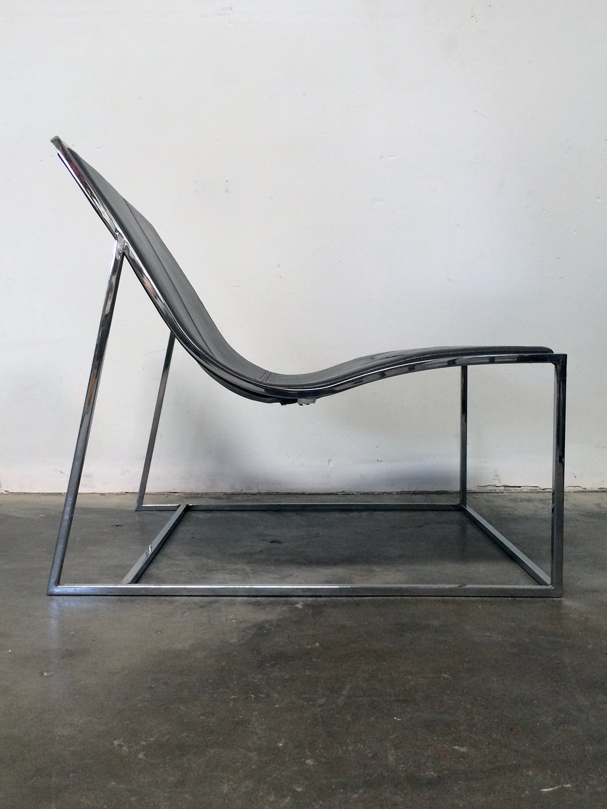 The chrome plated steel frame is thin but eye catching in its lines and harmonious proportions.  This stylish and very comfortable is upholstered in grey leather .
Jean-Marie Massaud  is a French architect, inventor and designer born in Toulouse.