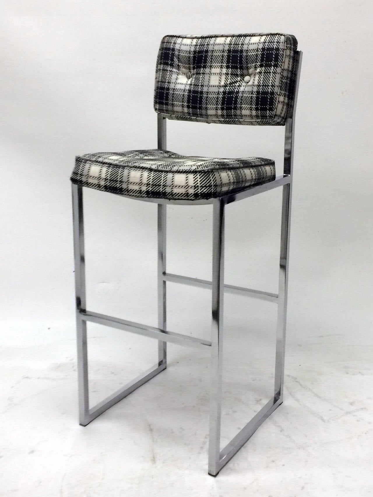 This unique pair of tufted faux plaid vinyl bar stools by Chromcraft are mounted on sturdy chrome plated tubular frames and are the perfect height for bar.