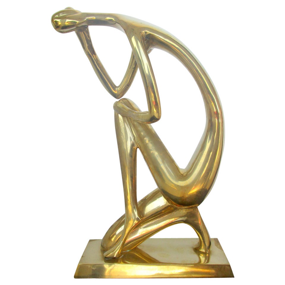 Stylized Brass Sculpture of a Woman at 1stDibs