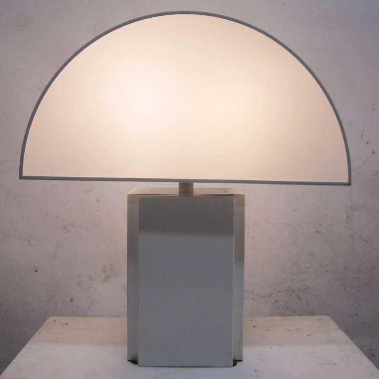 This stylish 70s lamp is attributed to Harvey Guzzini.  Maker's label reads: 