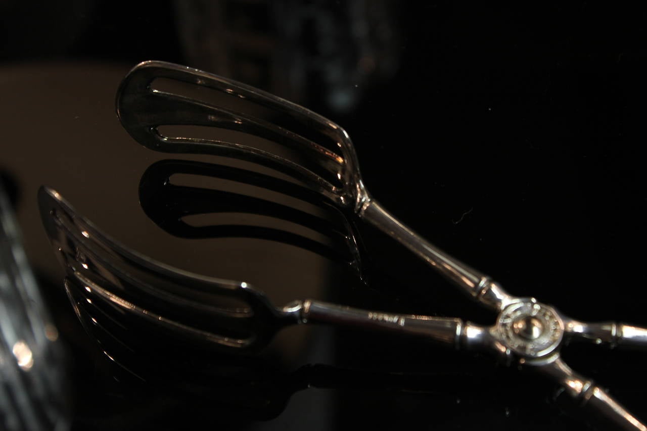 Great pair of Italian Silver Tongs that are a perfect accent to any collection!  Marked Landes E.P. Zinc.  1940s Italy.