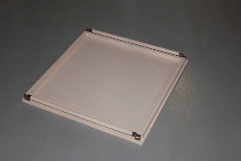 Ivory leather oversized tray with nickel handles.