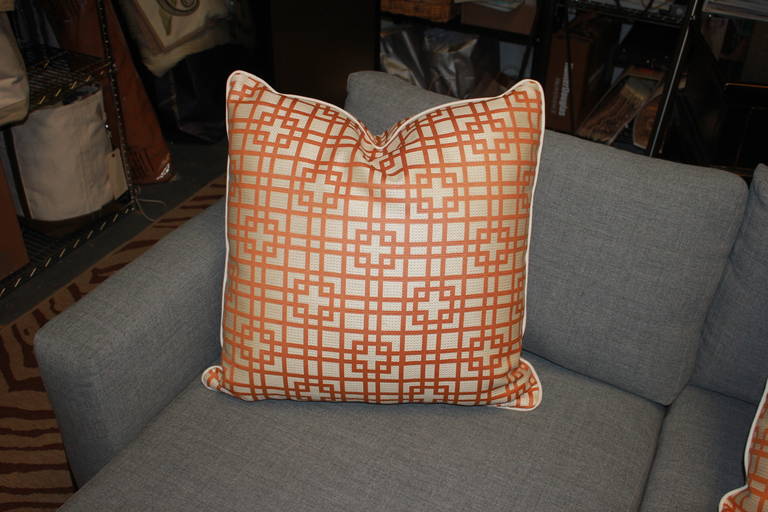 Tangerine and cream outdoor pillow in amazing fabric. Beautifully piped. High quality fast drying insert. Available individually for $275.