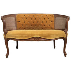Ornate Mustard Velvet Upholstered Settee with Rattan Panels and Tufted Back