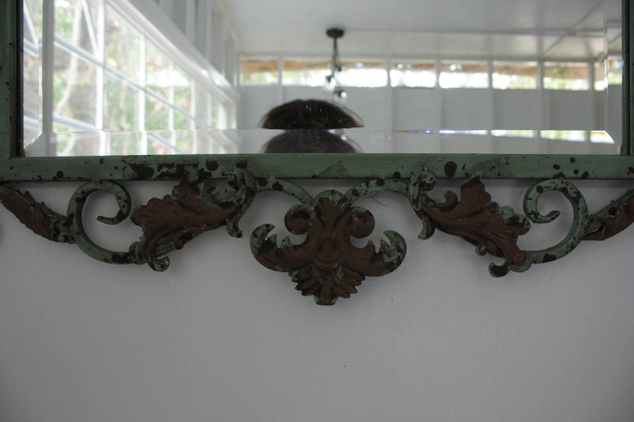 Fantastic Orlean's vintage mirror.  Beautifully distressed verdigris finish.  Perfectly suitable for indoor or outdoor use.  Ornate wire frame composition. Circa 1980's