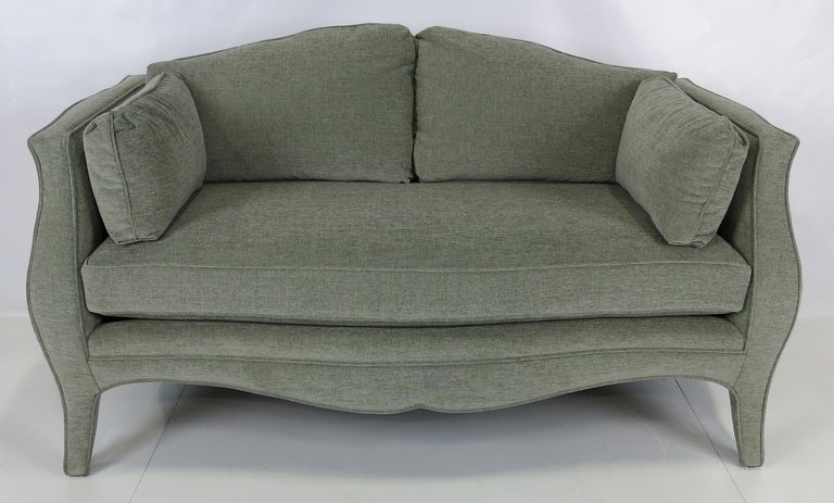 Fine and sensuously curvy vintage canapé. Best quality hardwood frame and feather cushions. Freshly reupholstered in luxurious heavyweight dove grey velvet.  This loveseat is identical to examples by noted designer, Richard Himmel.  Top quality