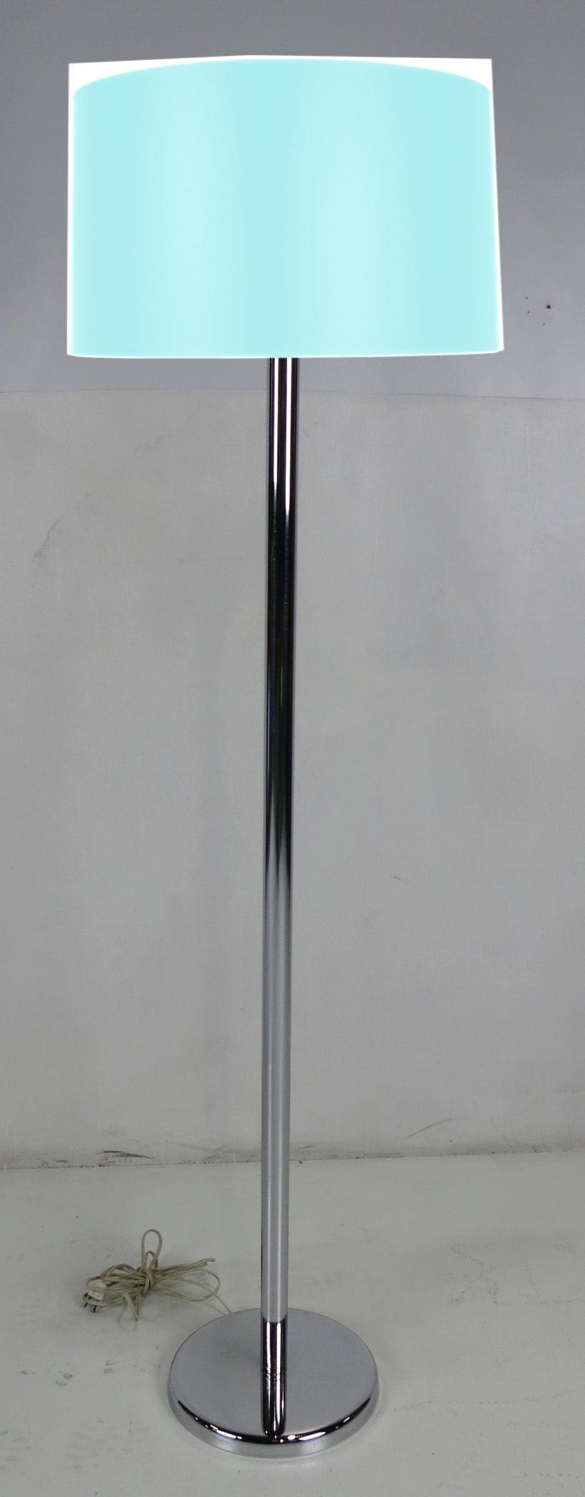 Vintage chrome floor lamp with a unique five socket cluster. The cluster has two-light sockets oriented vertically and a single uplight on top of the cluster. The chrome is in excellent condition with no corrosion or pitting on chrome. Lead weighted