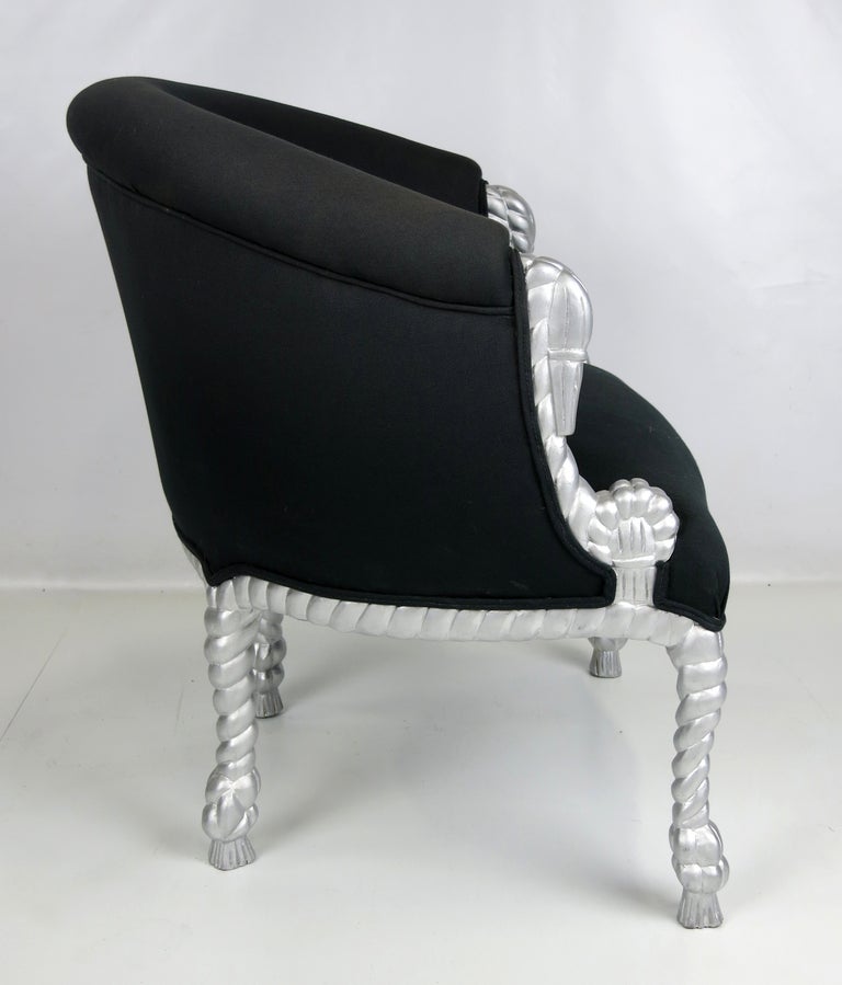 Pair of Napoleon lll style armchairs with silver carved rope and tassel motif frame.