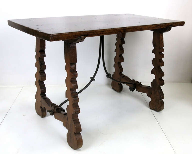 Dramatic Antique Writing Table with hand planed top and ornamental wrought iron stretcher.  This dramatic and versatile table can work as a breakfast table, sofa table, entry table, night table, end table...