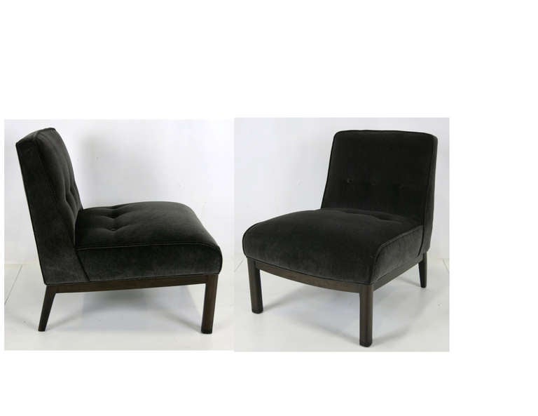 Pair of Modern Slipper Chairs on Walnut bases with leather cuffed feet.  The pair have been freshly refinished and reupholstered in luxurious heavyweight Charcoal Grey velvet.