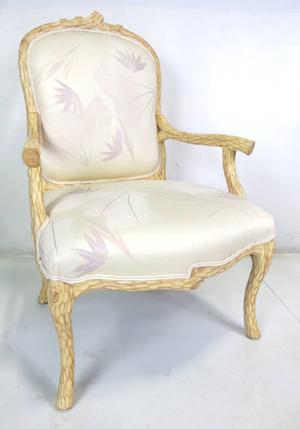 Beautifully carved pair of faux bois armchairs with their original period upholstery. The chairs and their upholstery appears as new and unused.