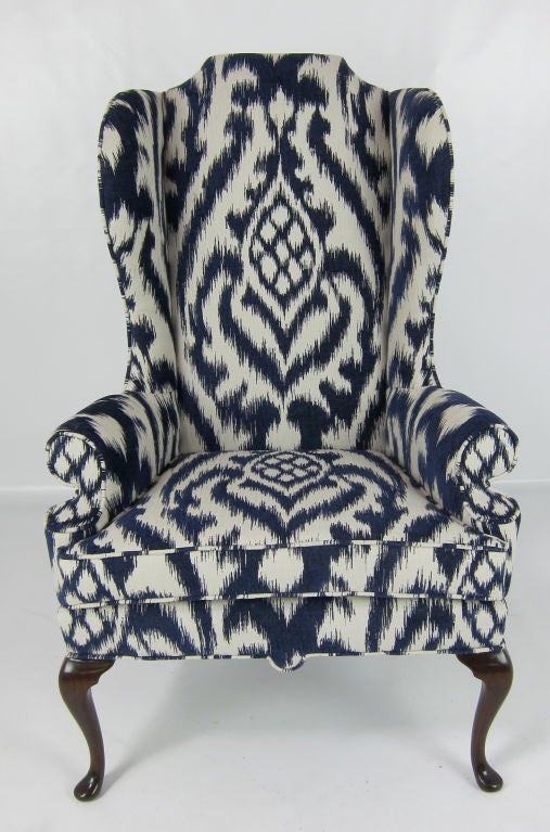 Beautifully crafted Pair of Queen Anne Style Wing Chairs.  The Mahogany frames have been refinished in Dark Brown Lacquer.  Freshly upholstered in heavy weight Woven Ikat fabric.  These chairs, with their 19