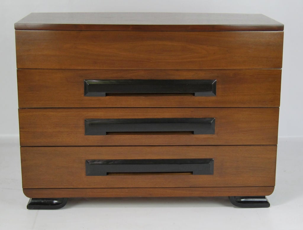Beautifully crafted Art Deco dresser with ebonized pulls and base.  The bow front top drawer has hidden fingerpulls on the bottom edge.