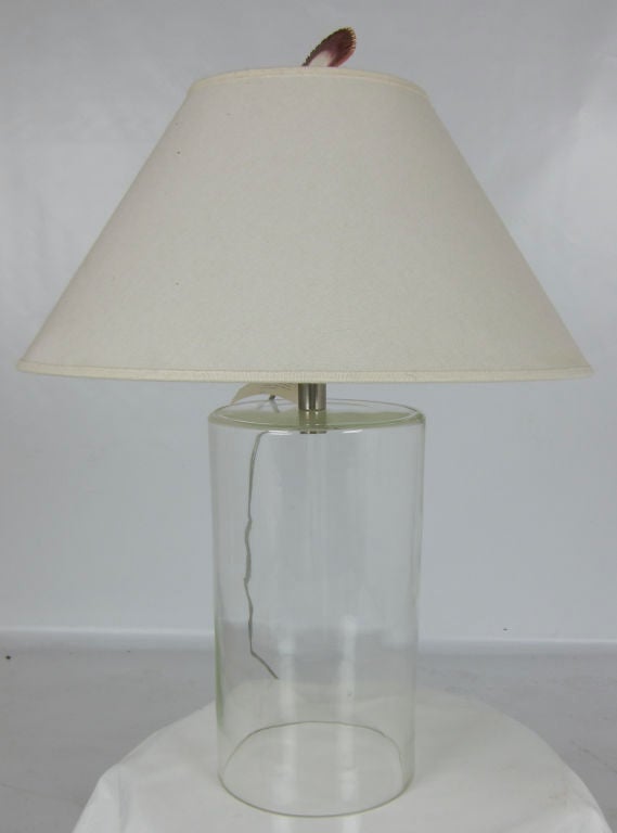 The classic glass lamp designed by John Saladino.  This is an early example that still bears its showroom tag and original shade.