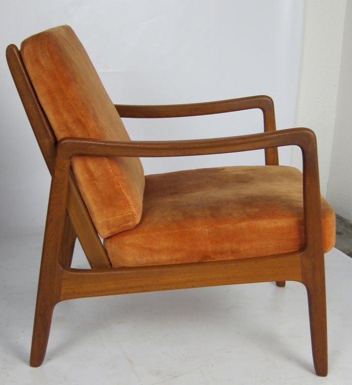 Lounge Chair by Ole Wanscher for France & Sons, distributed by John Stuart NY.  The frame is in excellent condition and the super comfortable seat and back cushions have internal springs.