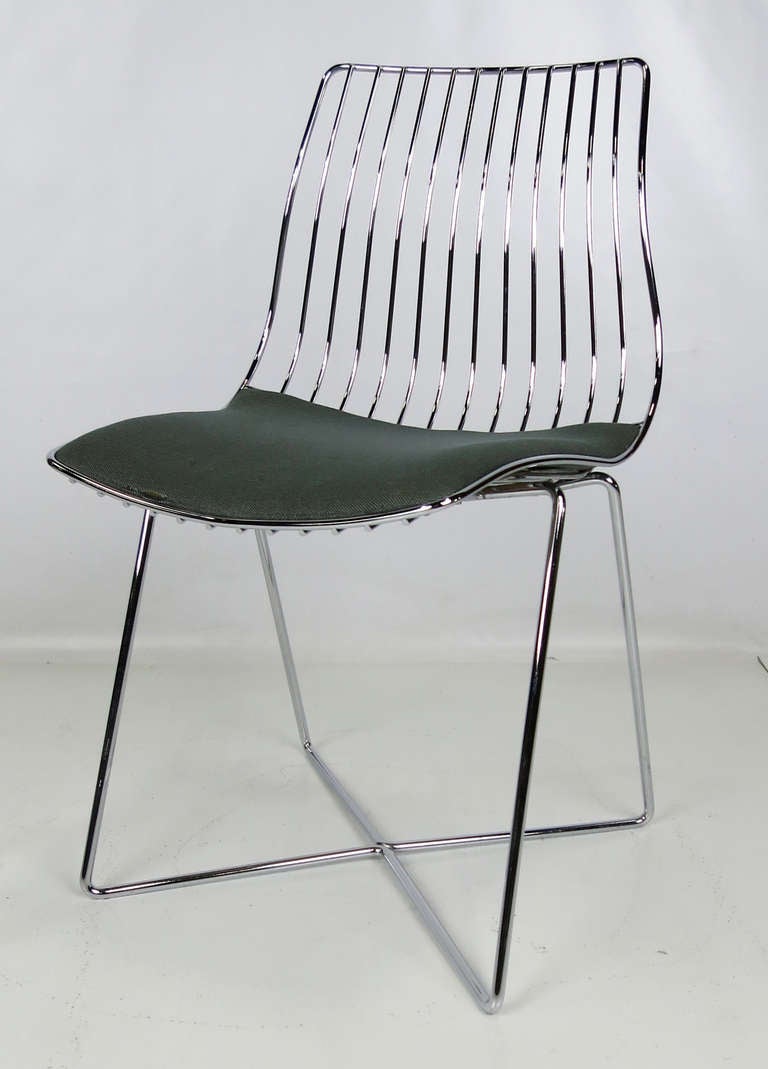 Chrome Wire Occasional Chair with crossed base and upholstered seat.